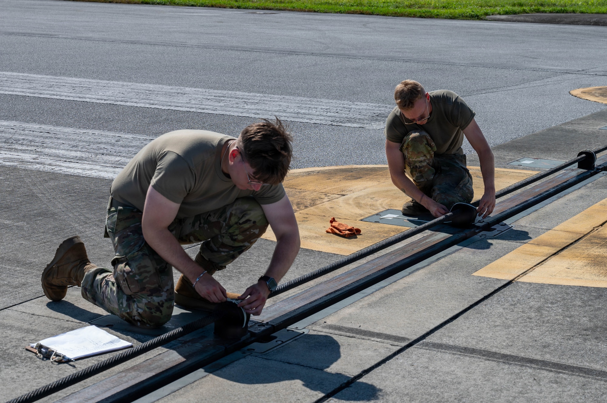 Service members ties string on blocks.