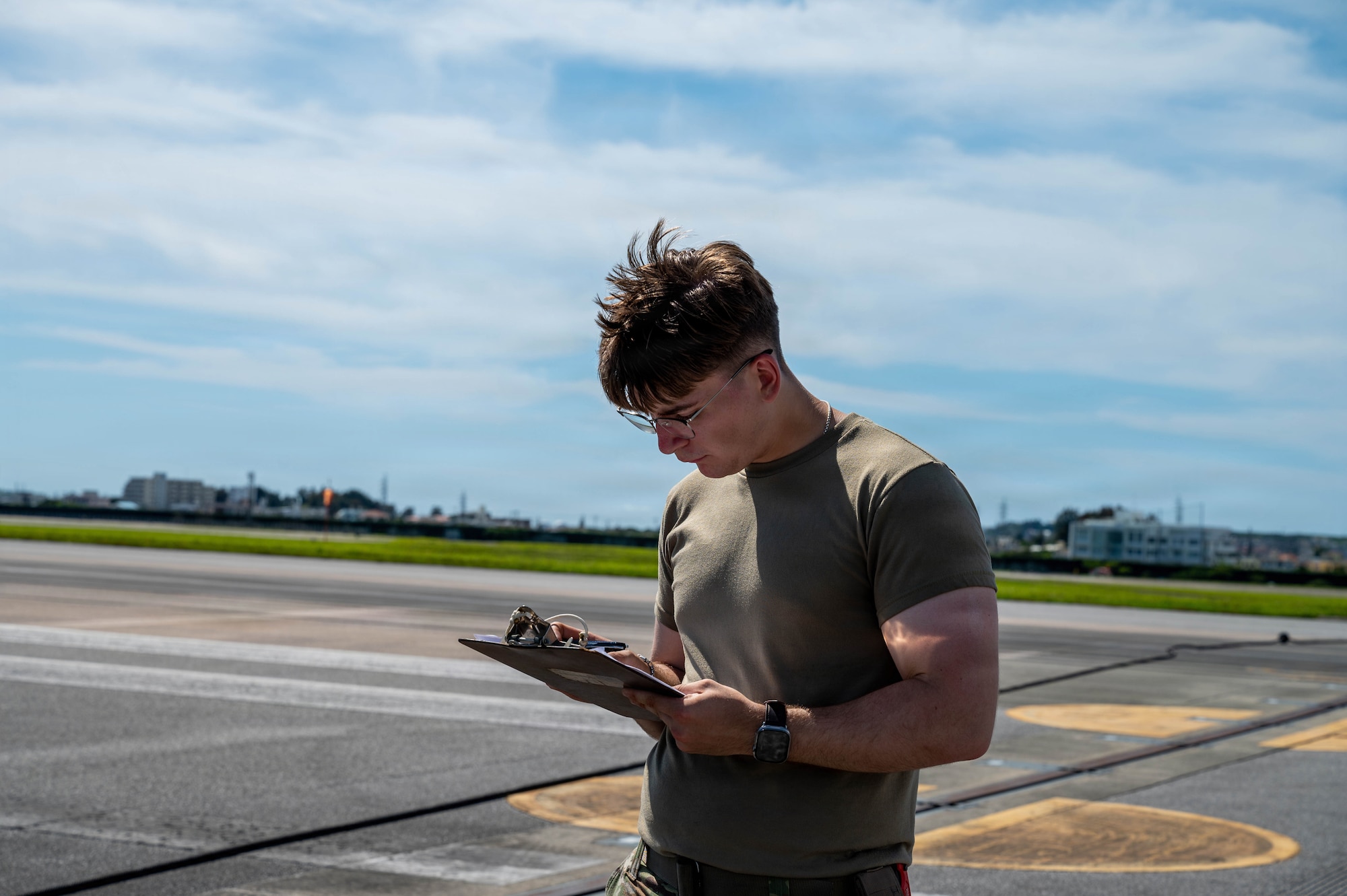 Service member writes report.