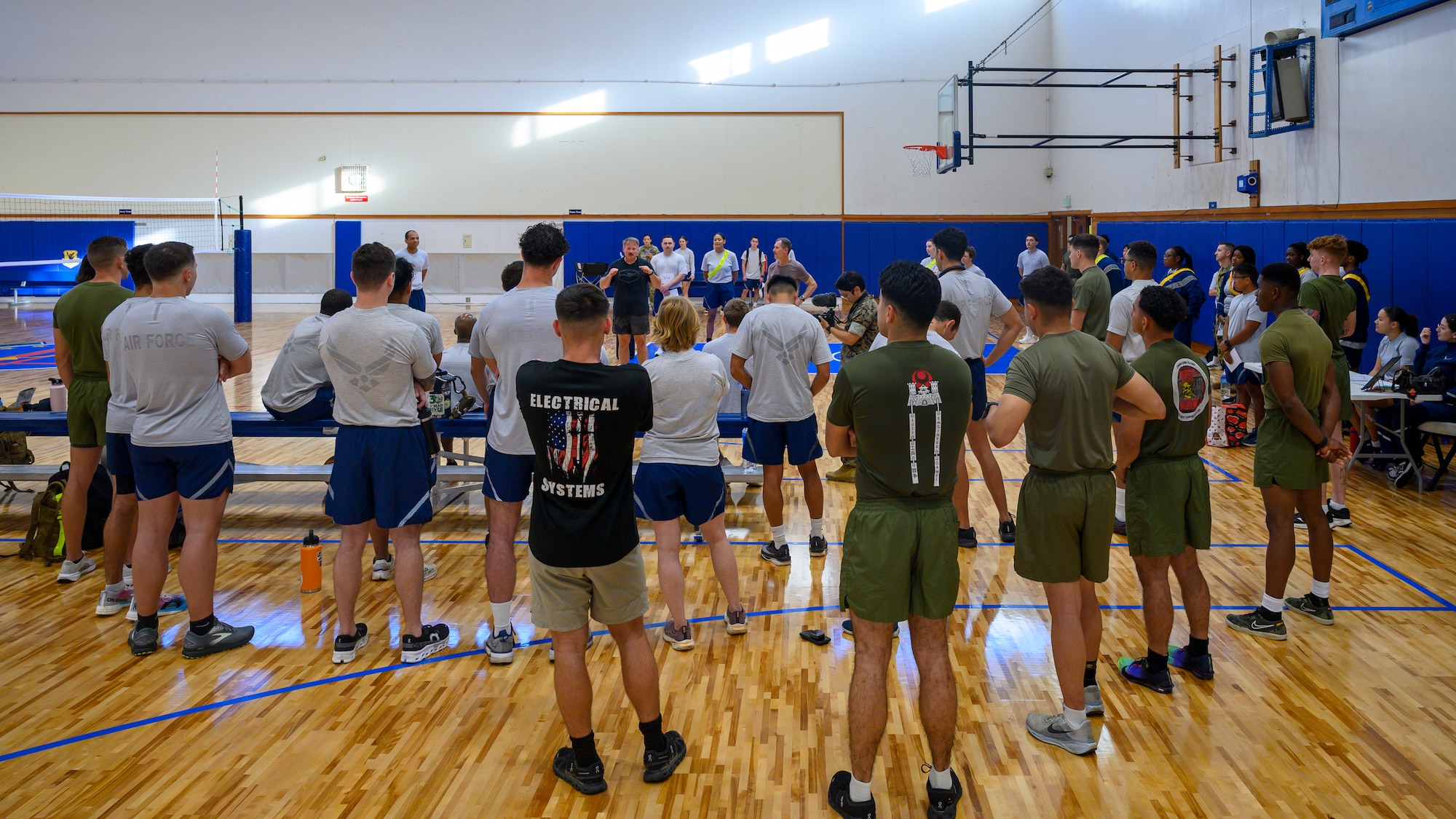 U.S. service members from across the joint force gather for opening remarks during the Warrior Gauntlet at Kadena Air Base, Japan, May 8, 2026. The competition brought together Airmen, Soldiers, Sailors, Marines and Guardians to strengthen interoperability, teamwork and warrior ethos through a series of physically demanding events. (U.S. Air Force photo by Airman 1st Class Francisco Huerta)