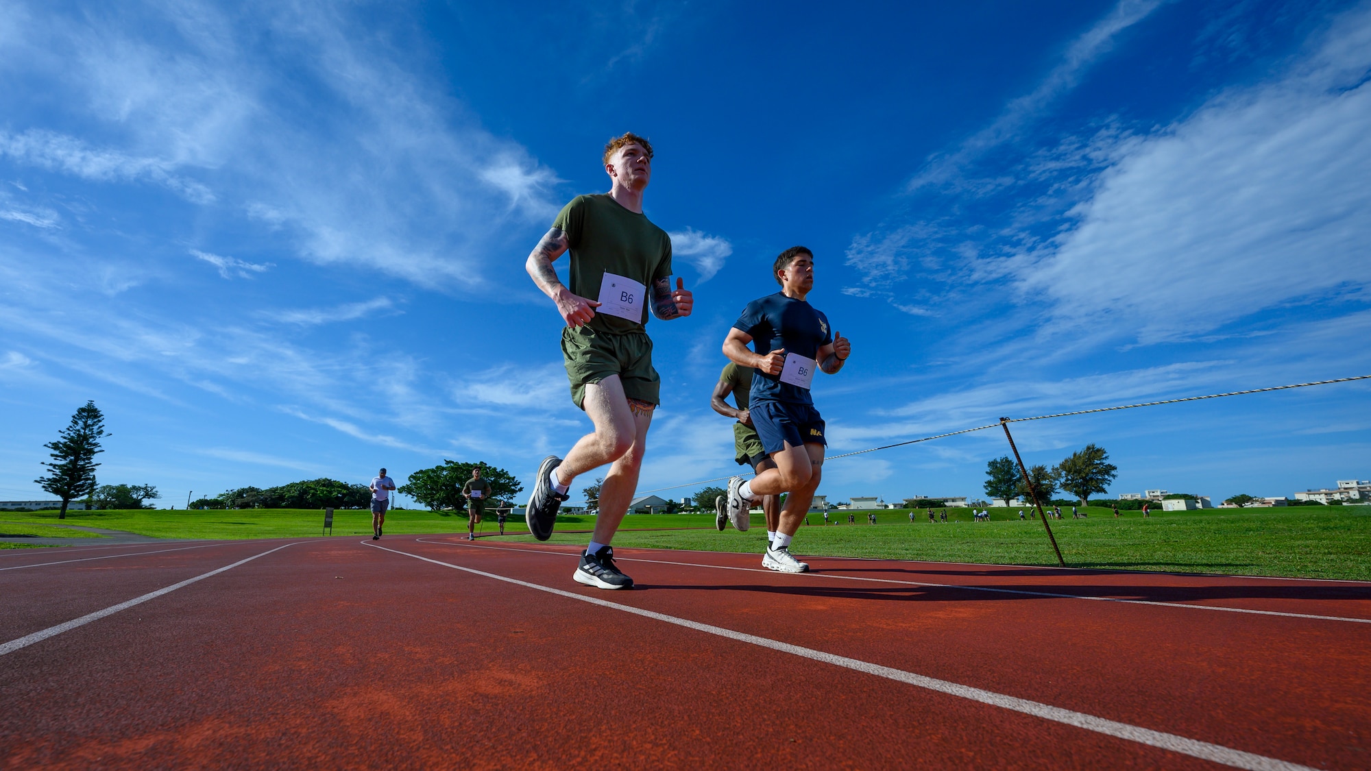 U.S. service members run two miles during the Warrior Gauntlet at Kadena Air Base, Japan, May 8, 2026. The endurance event pushed competitors to maintain speed and stamina while working together as a team. (U.S. Air Force photo by Airman 1st Class Francisco Huerta)