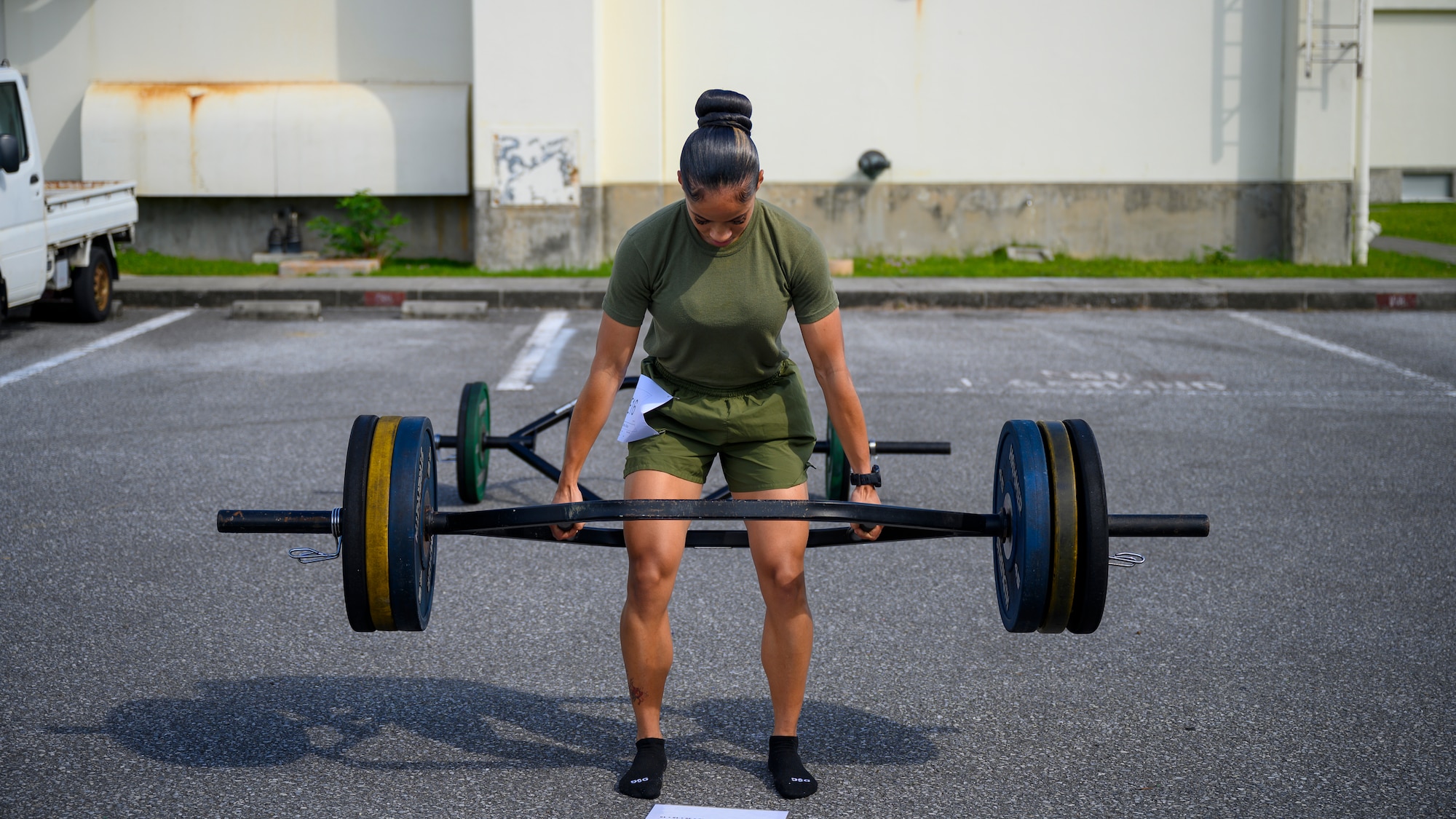 U.S. Marine Staff Sgt. Shaniya Sillers, Combat Logistics Regiment III MEF inventory management specialist, attempts a maximum deadlift during the Warrior Gauntlet at Kadena Air Base, Japan, May 8, 2026. The competition highlighted the physical readiness and warrior spirit shared across the joint force. (U.S. Air Force photo by Airman 1st Class Francisco Huerta)