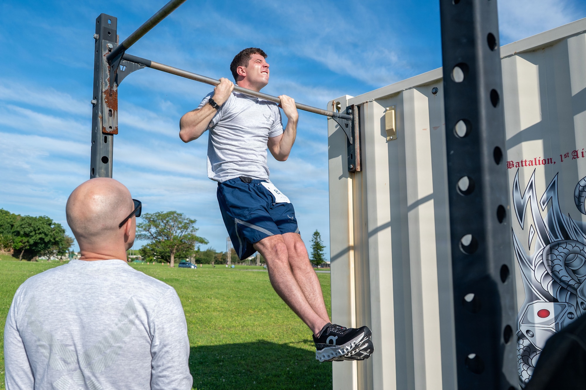 U.S. Air Force Master Sgt. Logan Schiermeyer, 718th Aircraft Maintenance Squadron production assistant, performs pull-ups during the Warrior Gauntlet at Kadena Air Base, Japan, May 8, 2026. Service members tested themselves against the fitness standards of every U.S. military branch during the joint-force challenge. (U.S. Air Force photo by Senior Airman Greydon Furstenau)