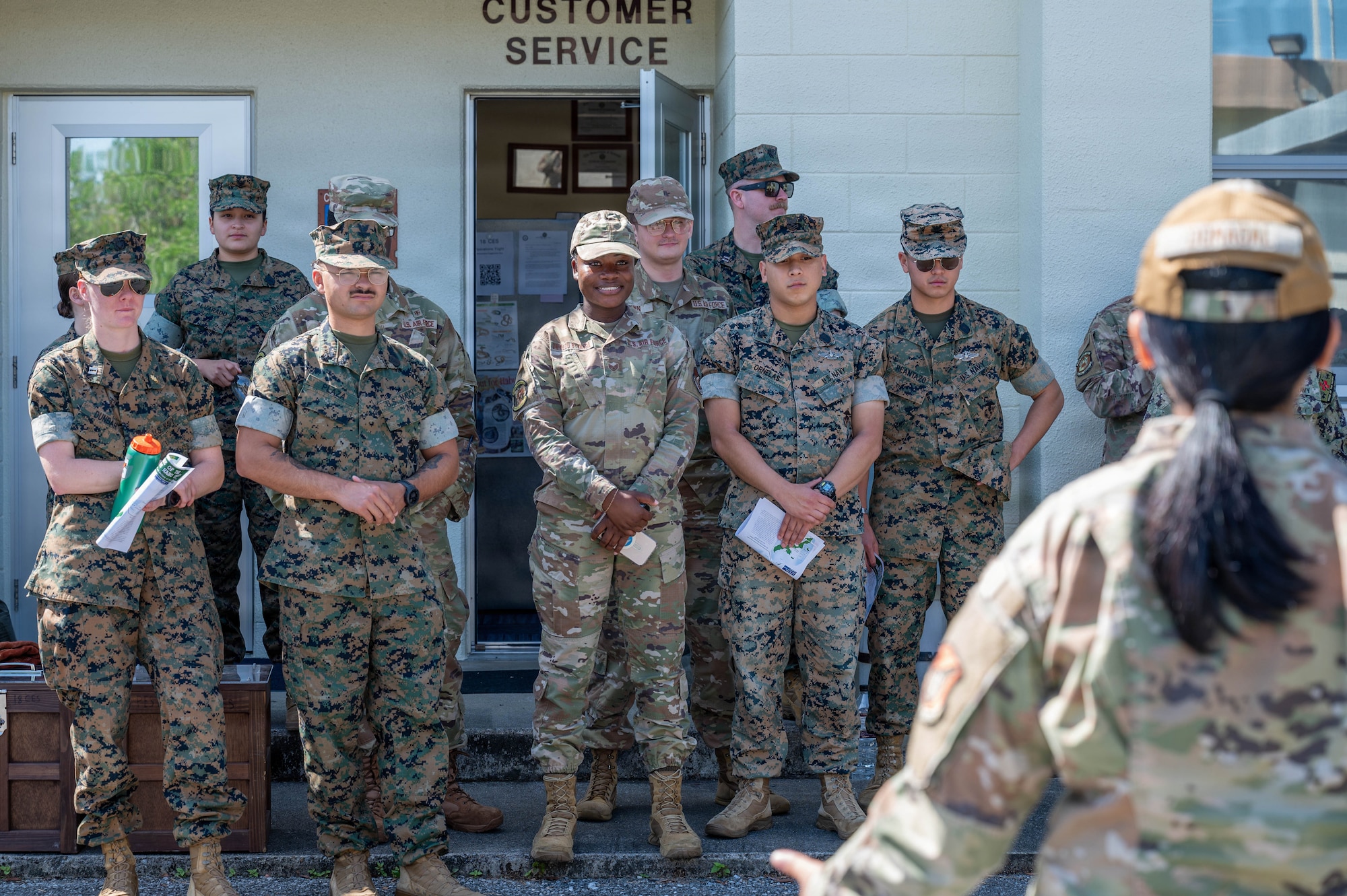 Service members listen to instruction.