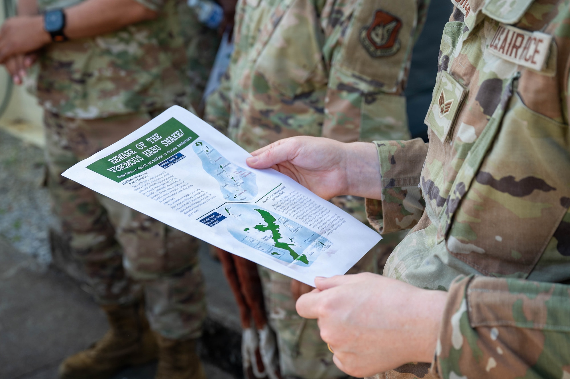 Service member reads pamphlet.