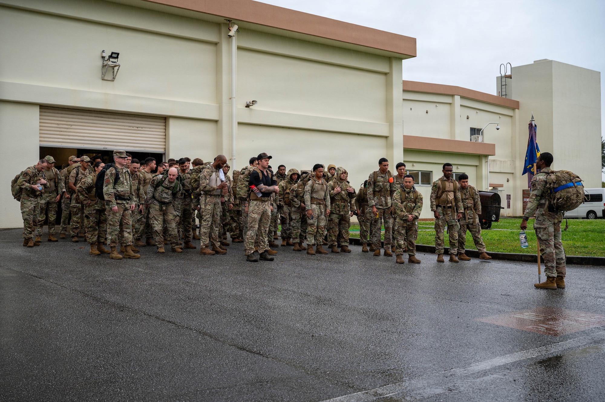 U.S. Air Force Airmen assigned to the 18th Security Forces Squadron gather outside their squadron prior to a Police Week ruck march.