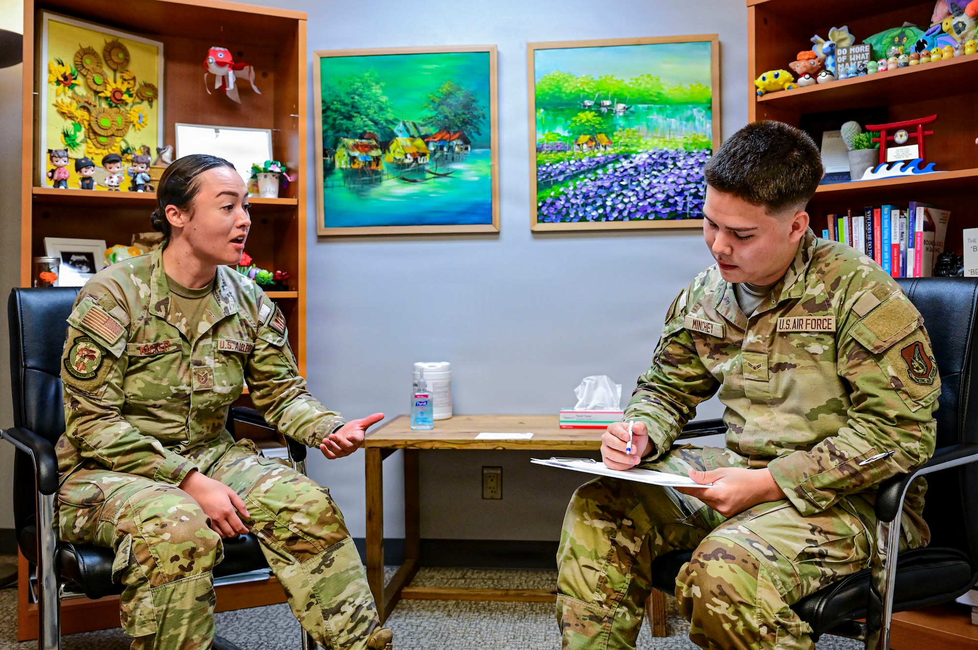 U.S. Service members speak to each other.