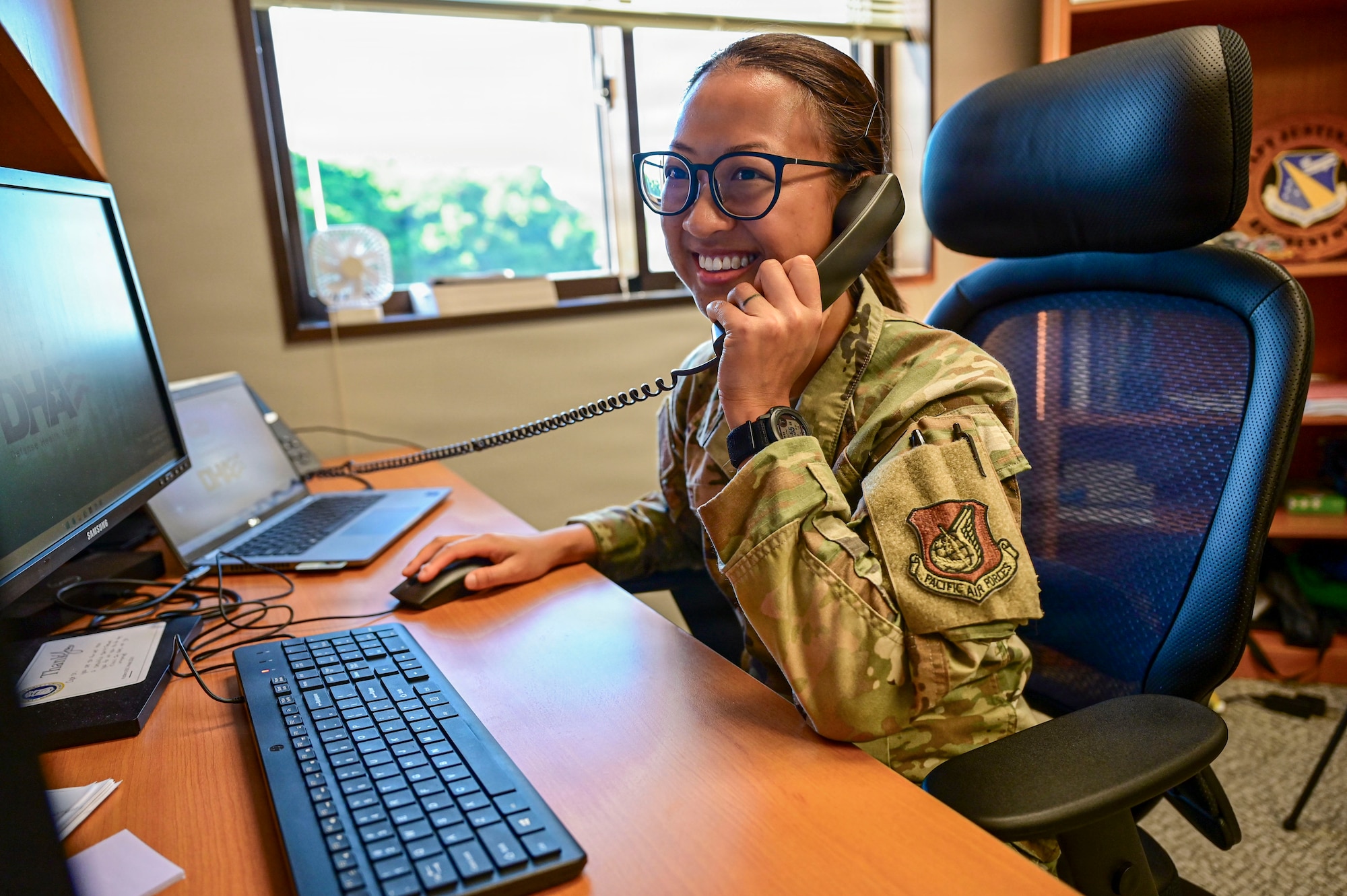 U.S. Service member handles phone call.
