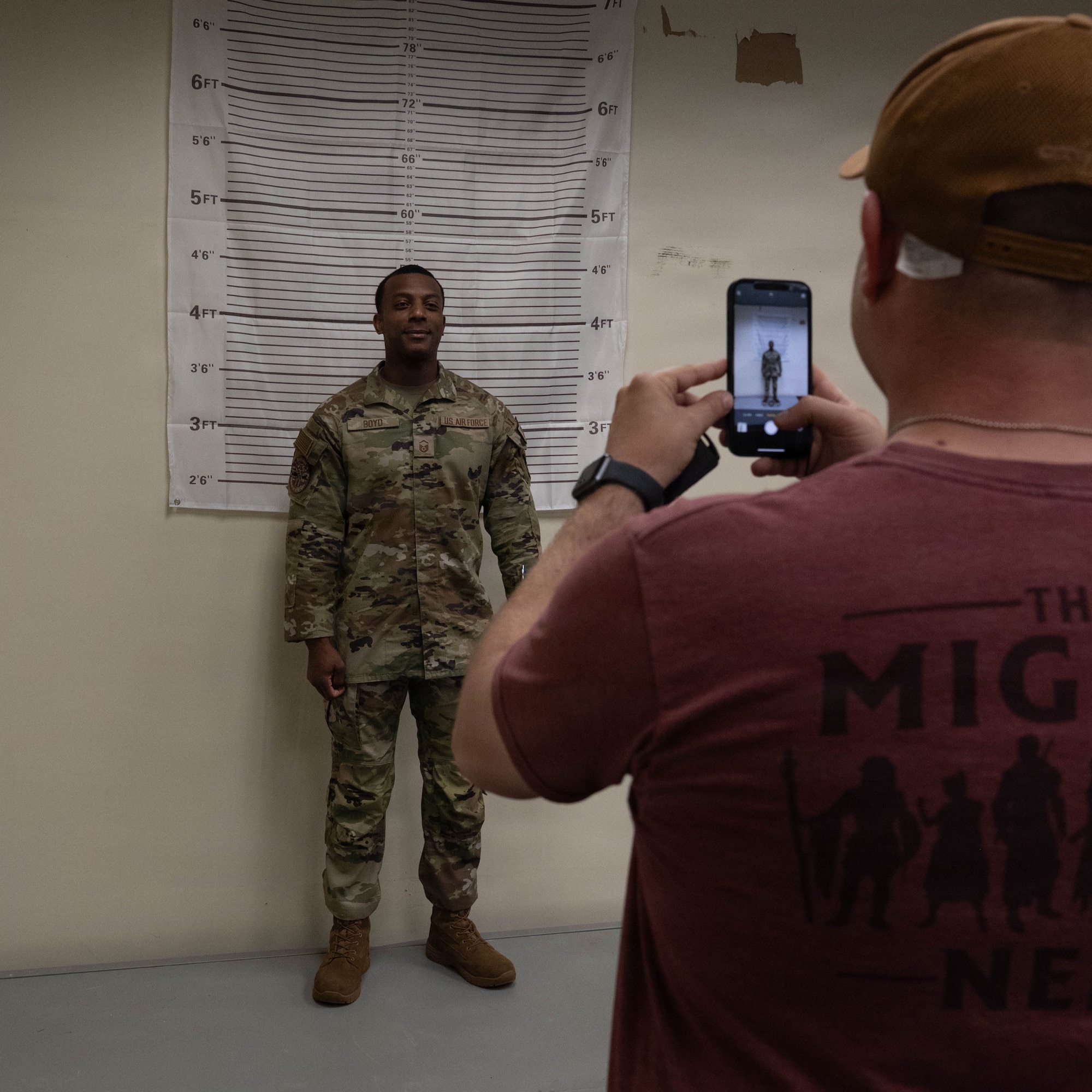 Airmen gets photo taken.