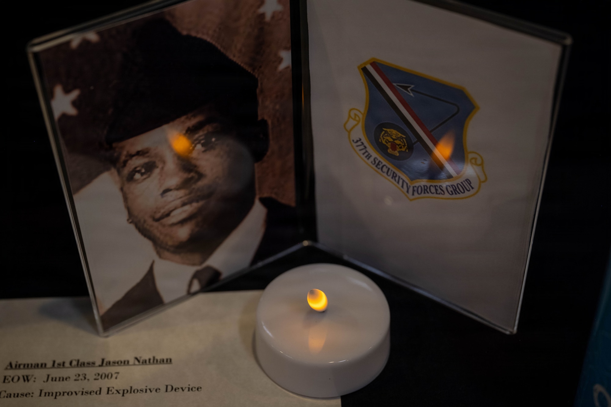 A memorial portrait is displayed on a table.