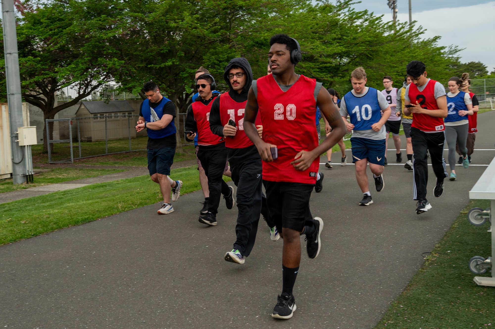 Participants run during a baseline two-mile assessment during a running clinic.