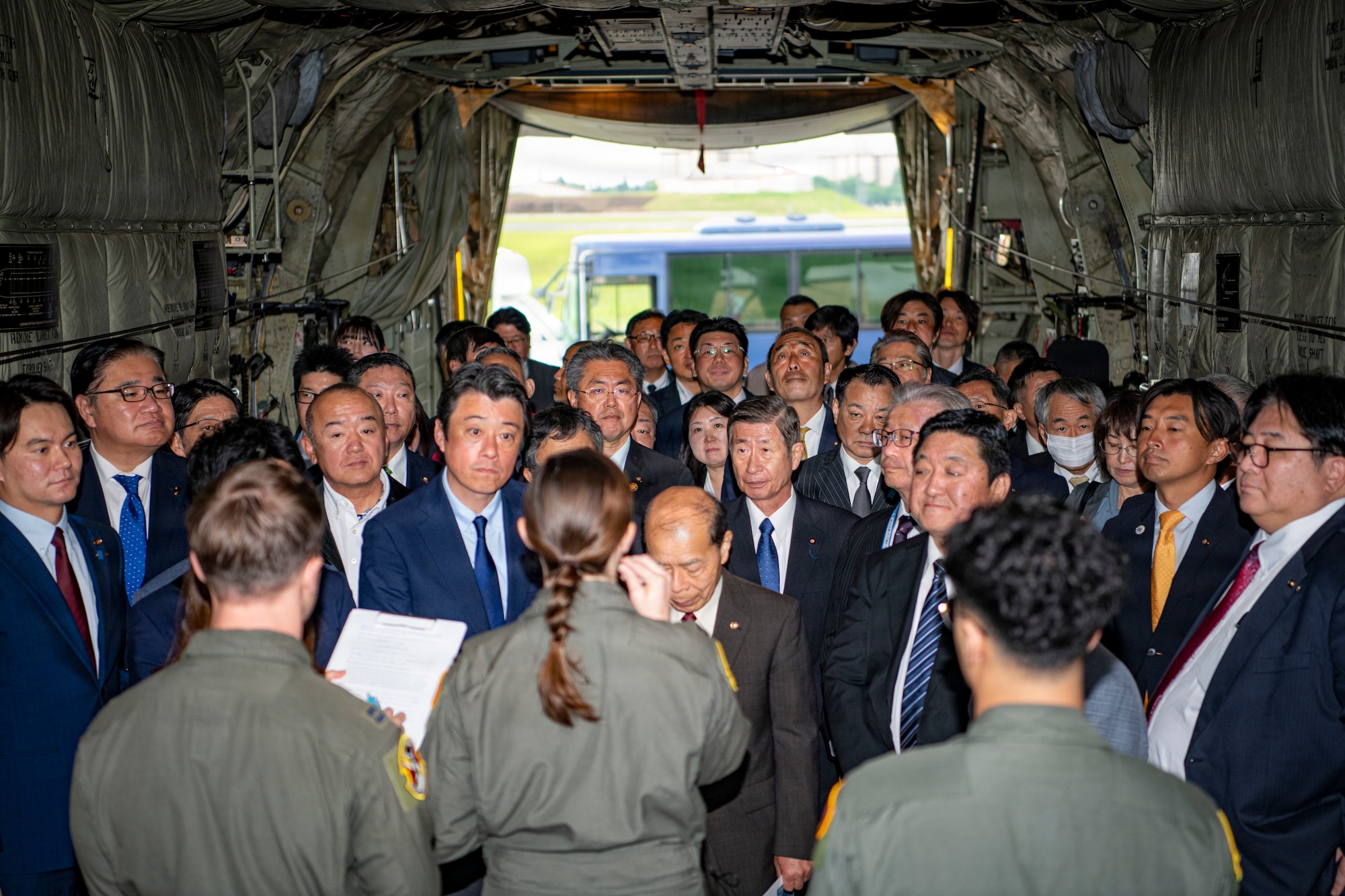 Members assigned to the 36th Airlift Squadron brief local council members inside a C-130J Super Hercules during a community relations tour at Yokota Air Base, Japan, April 30, 2026.