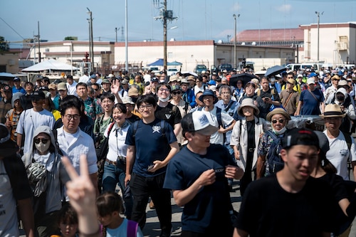 Japanese community members make their way onto the flight line at the start of the 2026 U.S.-Japan Friendship Festival at Yokota Air Base, Japan, May 16, 2026.