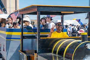A festival volunteer poses for a photo before driving families around the flightline during the 2026 Japanese-American Friendship Festival at Yokota Air Base, Japan, May 17, 2026.