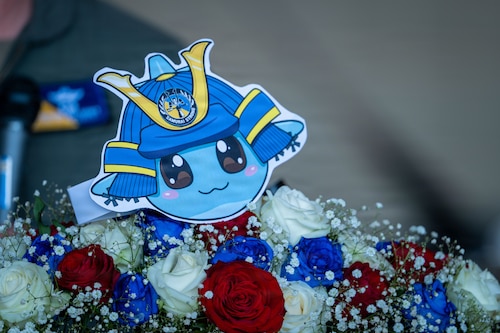A cutout of the installation mascot on display