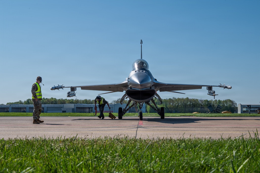 A person oversees an aircraft being refueled.