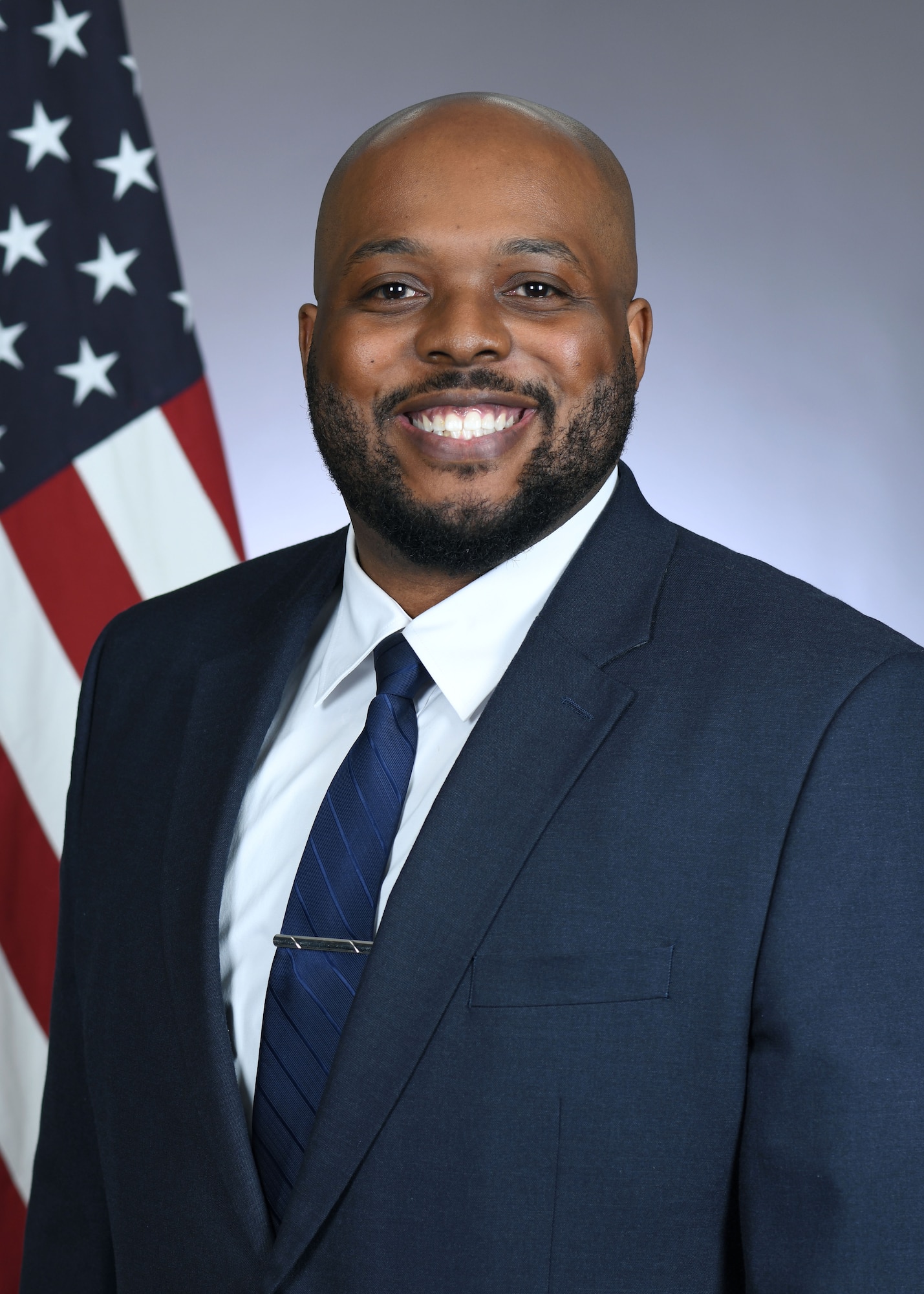 Darrin Alexander, 100th Air Refueling Wing chief of information protection, poses for his official photo at RAF Mildenhall, England, March 24,2026. He recently won the U.S. Air Forces in Europe – Air Forces Africa-level Security Award for Excellence 2025 and is now competing at Air Force level. Alexander’s accomplishments include eliminating a 3,000-item clearance backlog, directly boosting mission readiness, and creating a centralized Information Protection SharePoint, providing unified resources for all assigned and tenant units. (U.S. Air Force photo by Karen Abeyasekere)