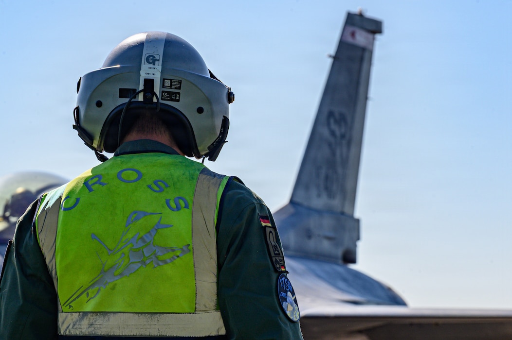 A person oversees an aircraft being refueled.