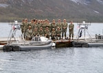 RAMSUND, Norway (May 12, 2026) — Commander, Task Force (CTF) 66 and Unmanned Surface Vessel Squadron Three (USVRON 3) Division 32 personnel pose for a photo during Arctic Sentry 2026. Commander, Task Force (CTF) 66 and CTF 68 are conducting a multi-domain military exercise with the Norwegian Armed Forces to strengthen our combined posture in the Arctic. (U.S. Navy photo by Mass Communication Specialist 1st Class Brandie Nuzzi)