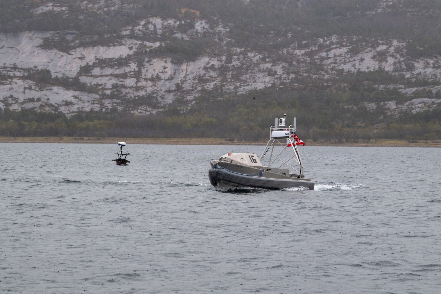 RAMSUND, Norway (May 12, 2026) — A Global Autonomous Reconnaissance Craft and Lightfish Unmanned Surface Vessel, attached to Commander, Task Force (CTF) 66, operate in Breivika Bay during Arctic Sentry 2026.