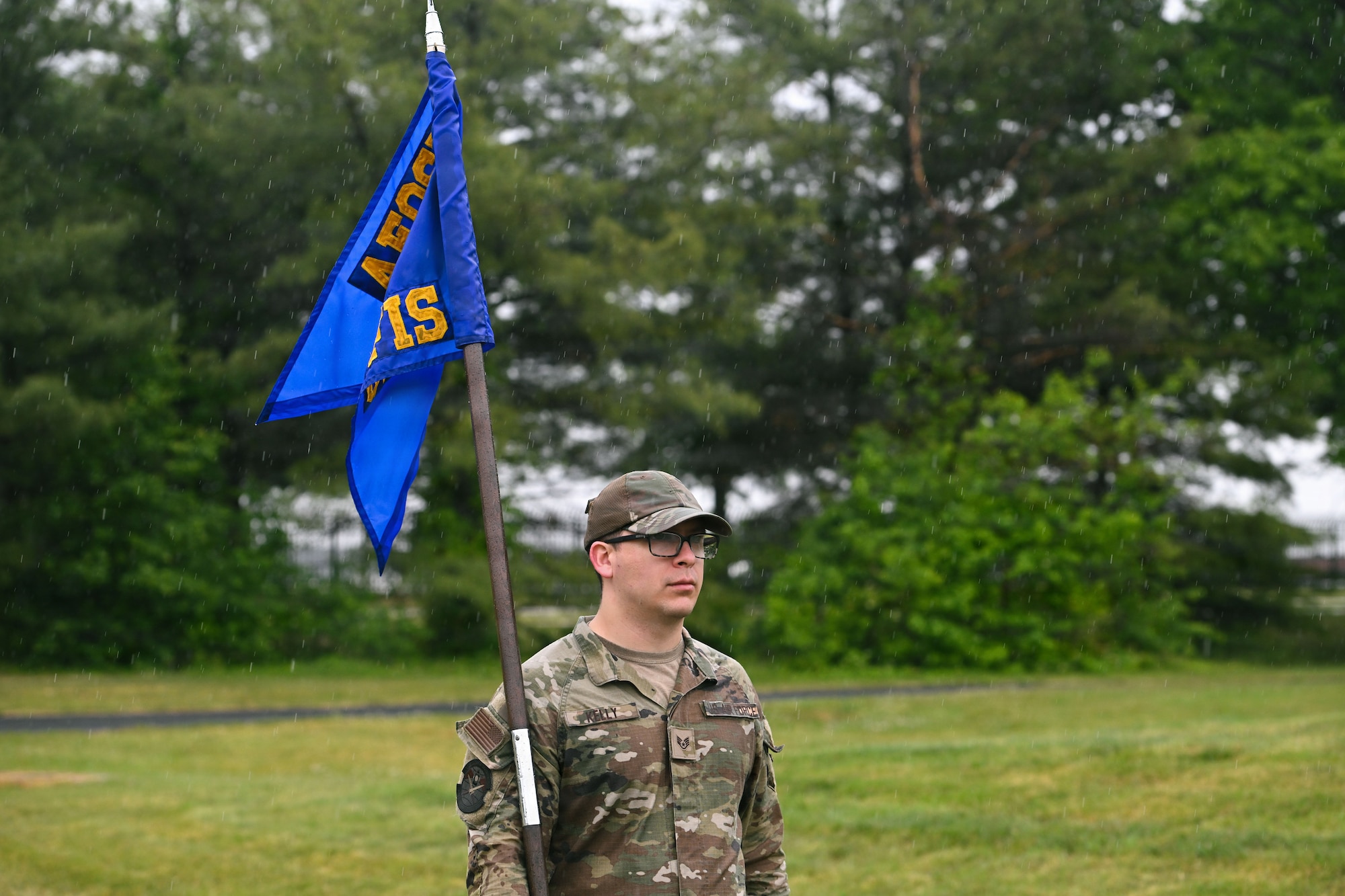 U.S. Air Force Staff Sgt. Patrick Kelly, Office of Special Investigations 2nd Field Investigations Squadron investigator, carries the guidon during a memorial ruck during National Police Week at Joint Base Andrews, Maryland, May 11, 2026.