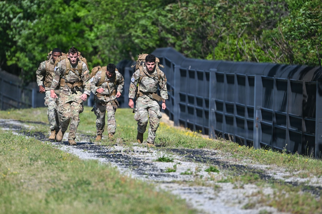 Airmen assigned to the 11th Security Forces Squadron compete in a warrior challenge during National Police Week at Joint Base Andrews, Maryland, May 13, 2026.