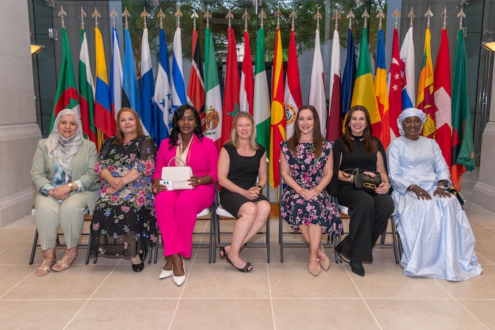 IHR 2026 International Spouses pose for a group photo at the Alabama Supreme Court (U.S. Air Force photo by Trey Ward)