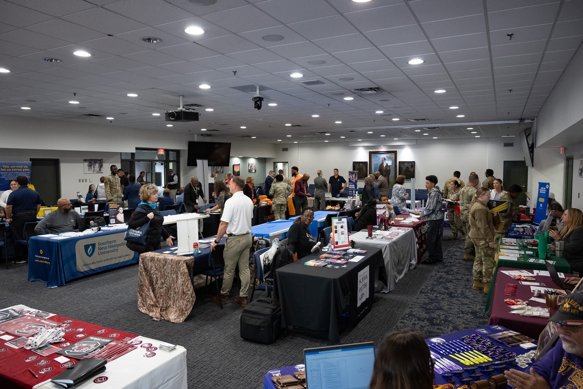 Airman explore a college fair.