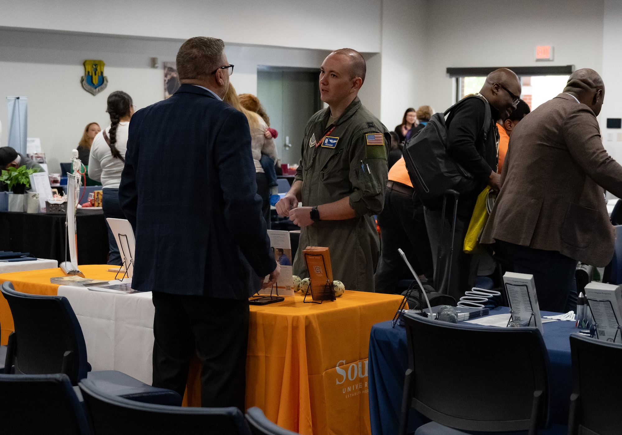 An Airman speaks with a person.