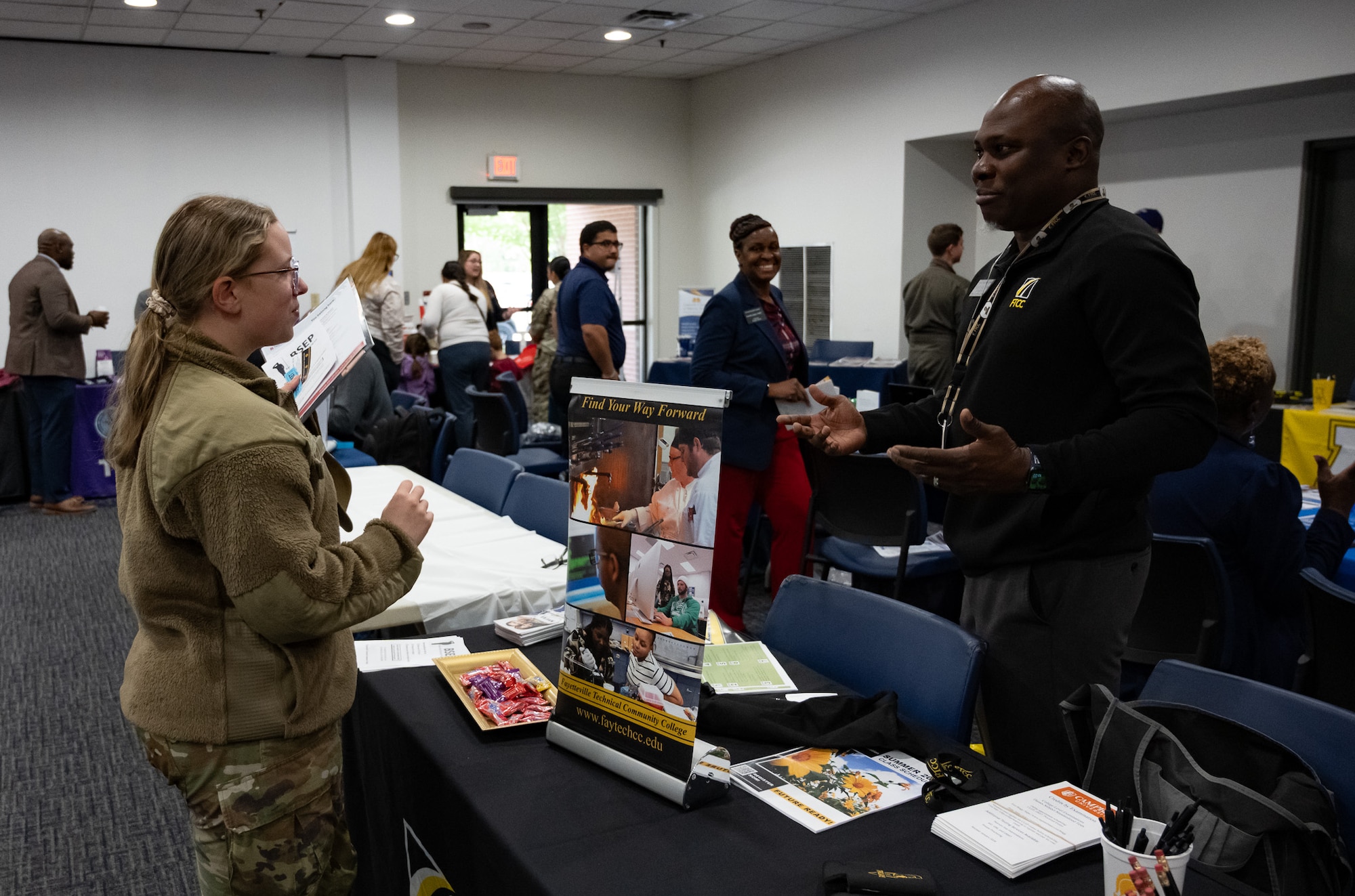 An Airman speaks with a person
