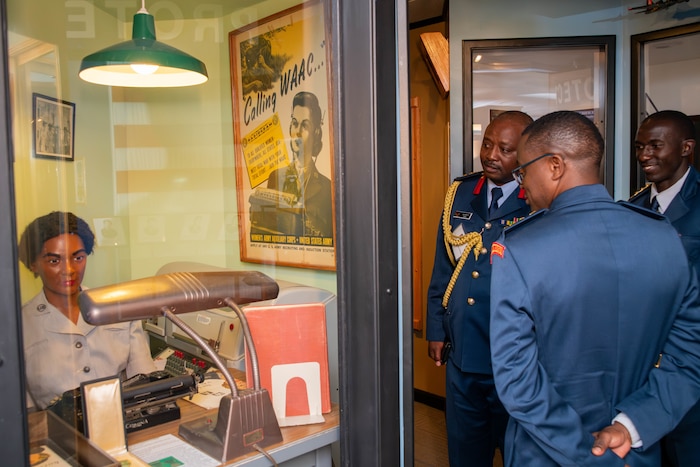 Kenyan Air Force Col. Christopher Mbutu, Col. Pius Leshan and Capt. Steve Lupao look at an exhibit in the Enlisted Heritage Hall at the Maxwell Air Force Base Gunter Annex, Alabama, April 10, 2026.