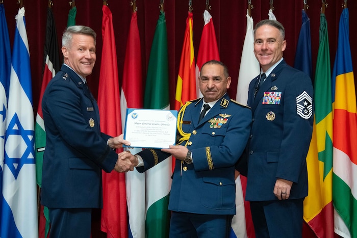 U. S. Air Force Lt. Gen. Daniel H. Tulley, Air University commander and president, and Chief Master Sergeant Raun M. Howell, AU command chief, induct Algerian Air Chief Maj. Gen. Zoubir Ghouila into the 2026 International Honor Roll at Maxwell Air Force Base, Alabama, Apr. 10, 2026.