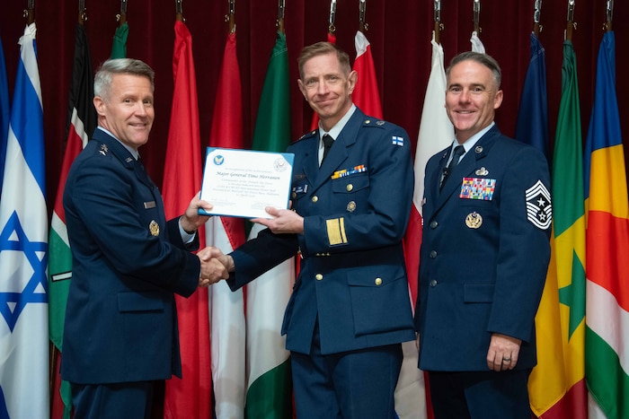 U. S. Air Force Lt. Gen. Daniel H. Tulley, Air University commander and president, and Chief Master Sergeant Raun M. Howell, AU command chief, induct Finnish Air Force Commander Maj. Gen. Timo Herranen into the 2026 International Honor Roll at Maxwell Air Force Base, Alabama, Apr. 10, 2026.