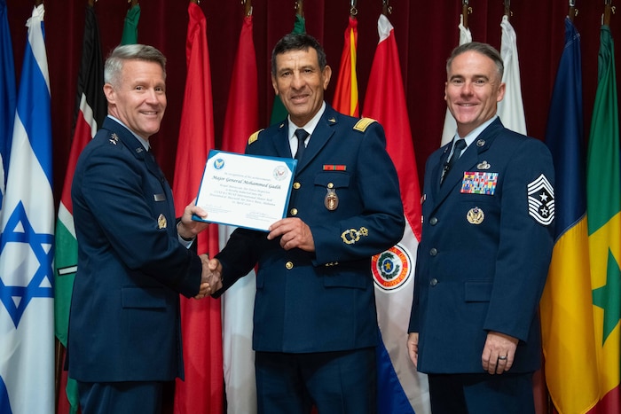 U. S. Air Force Lt. Gen. Daniel H. Tulley, Air University commander and president, and Chief Master Sergeant Raun M. Howell, AU command chief, induct Royal Moroccan Air Force Inspector Maj. Gen. Mohammed Gadih the 2026 International Honor Roll at Maxwell Air Force Base, Alabama, Apr. 10, 2026.