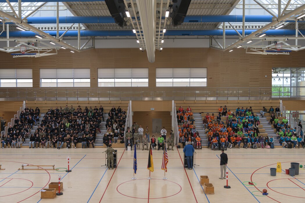 A gymnasium is full of people.