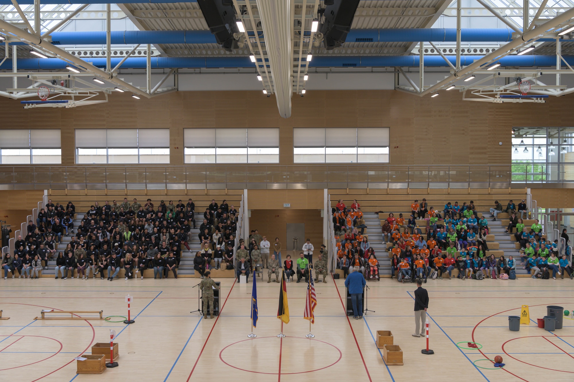 A gymnasium is full of people.