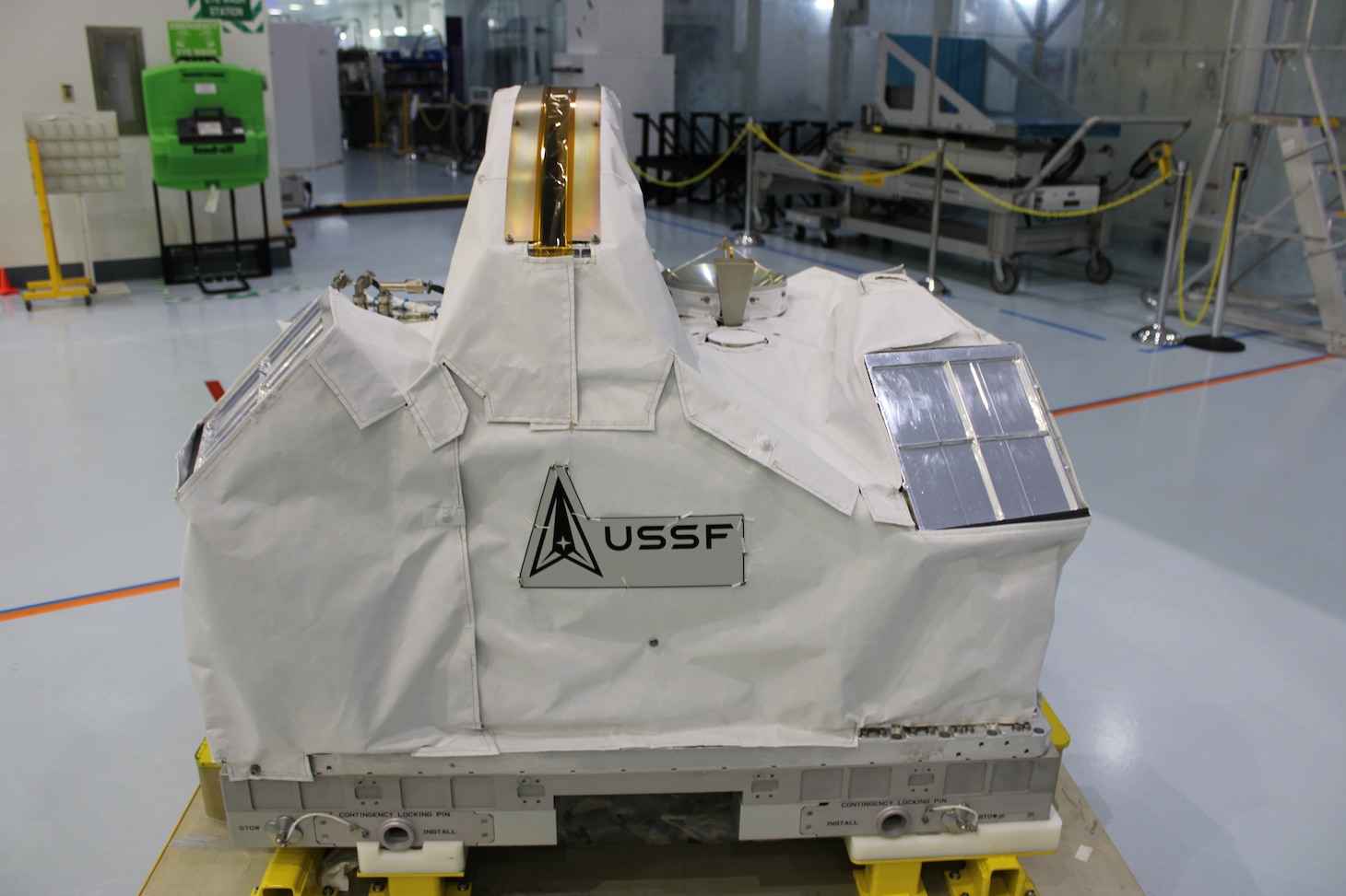 The Department of War Space Test Program – Houston 11 (STP-H11) payload at the Space Station Processing Facility at NASA's Kennedy Space Center, Fla., April 7, 2026. It is covered in blanketing material to protect the payloads from the space environment. After launch, the STP-H11 payload will be installed on the outside of the International Space Station’s Columbus module. (Credit: U.S. Space Force and NASA's Goddard Space Flight Center)