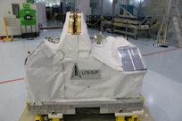 The Department of War Space Test Program – Houston 11 (STP-H11) payload at the Space Station Processing Facility at NASA's Kennedy Space Center, Fla., April 7, 2026. It is covered in blanketing material to protect the payloads from the space environment. After launch, the STP-H11 payload will be installed on the outside of the International Space Station’s Columbus module. (Credit: U.S. Space Force and NASA's Goddard Space Flight Center)