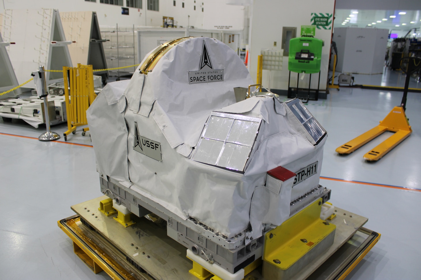 The Department of War Space Test Program – Houston 11 (STP-H11) payload at the Space Station Processing Facility at NASA's Kennedy Space Center, Fla., April 7, 2026. It is covered in blanketing material to protect the payloads from the space environment. After launch, the STP-H11 payload will be installed on the outside of the International Space Station’s Columbus module. (Credit: U.S. Space Force and NASA's Goddard Space Flight Center)