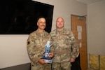 From left, U.S. Air Force Master Sgt. Jason Harden, 177th Fighter Wing Chaplain Corps superintendent, poses for a photo after receiving the Air National Guard Chaplain Corps Minuteman Award for 2025 from Col. Jonathan Bell, director of the Air National Guard Chaplain Corps, at the Atlantic City Air National Guard Base, May 16, 2026. Harden was awarded the Air National Guard Chaplain Corps Minutemen Award for 2025 for his actions during the D.C. Safe and Beautiful mission. Photo by Airman 1st Class Alex Cadavid.