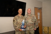 From left, U.S. Air Force Master Sgt. Jason Harden, 177th Fighter Wing Chaplain Corps superintendent, poses for a photo after receiving the Air National Guard Chaplain Corps Minuteman Award for 2025 from Col. Jonathan Bell, director of the Air National Guard Chaplain Corps, at the Atlantic City Air National Guard Base, May 16, 2026.