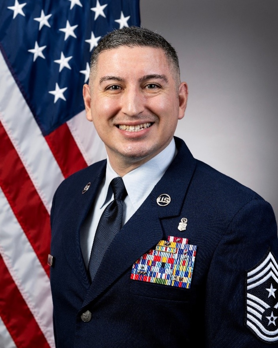 Service member poses for photo