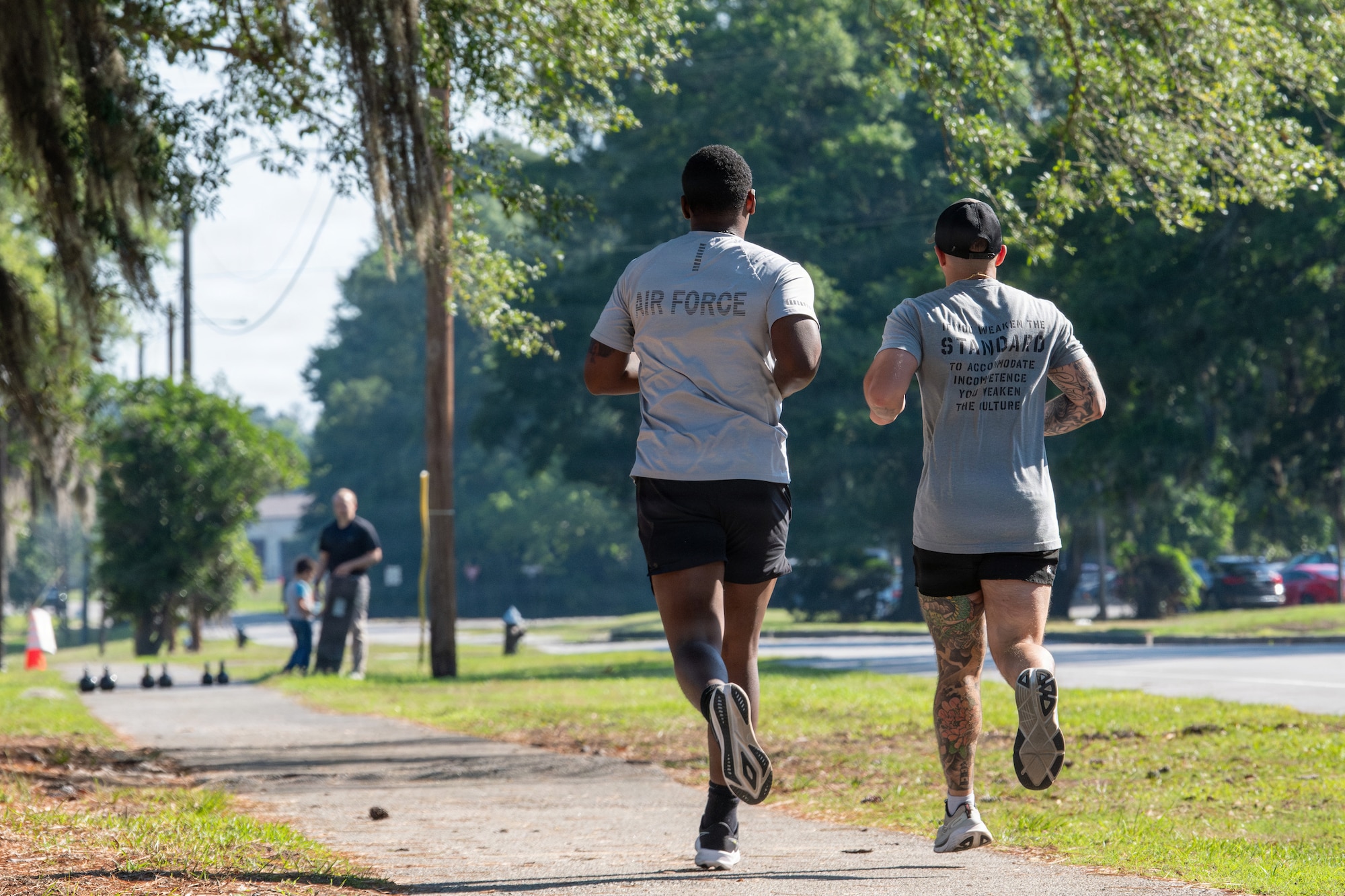 Service members running outside during the Warrior Challenge.