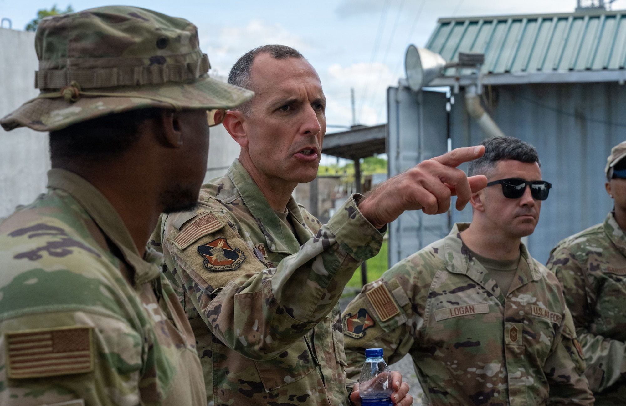 U.S. Air Force Col. Gabriel Brown, 406th Air Expeditionary Wing commander, center, talks to Airmen assigned to the 475th Expeditionary Air Base Squadron during a site visit at Manda Bay, Kenya, May 6, 2026. Brown and U.S. Air Force Chief Master Sgt. Jason Logan, 406th AEW command chief, visited Airmen and leaders throughout Manda Bay to discuss mission readiness, quality of life and ongoing operations. (U.S. Air Force photo by Maj. Porter Maerz)