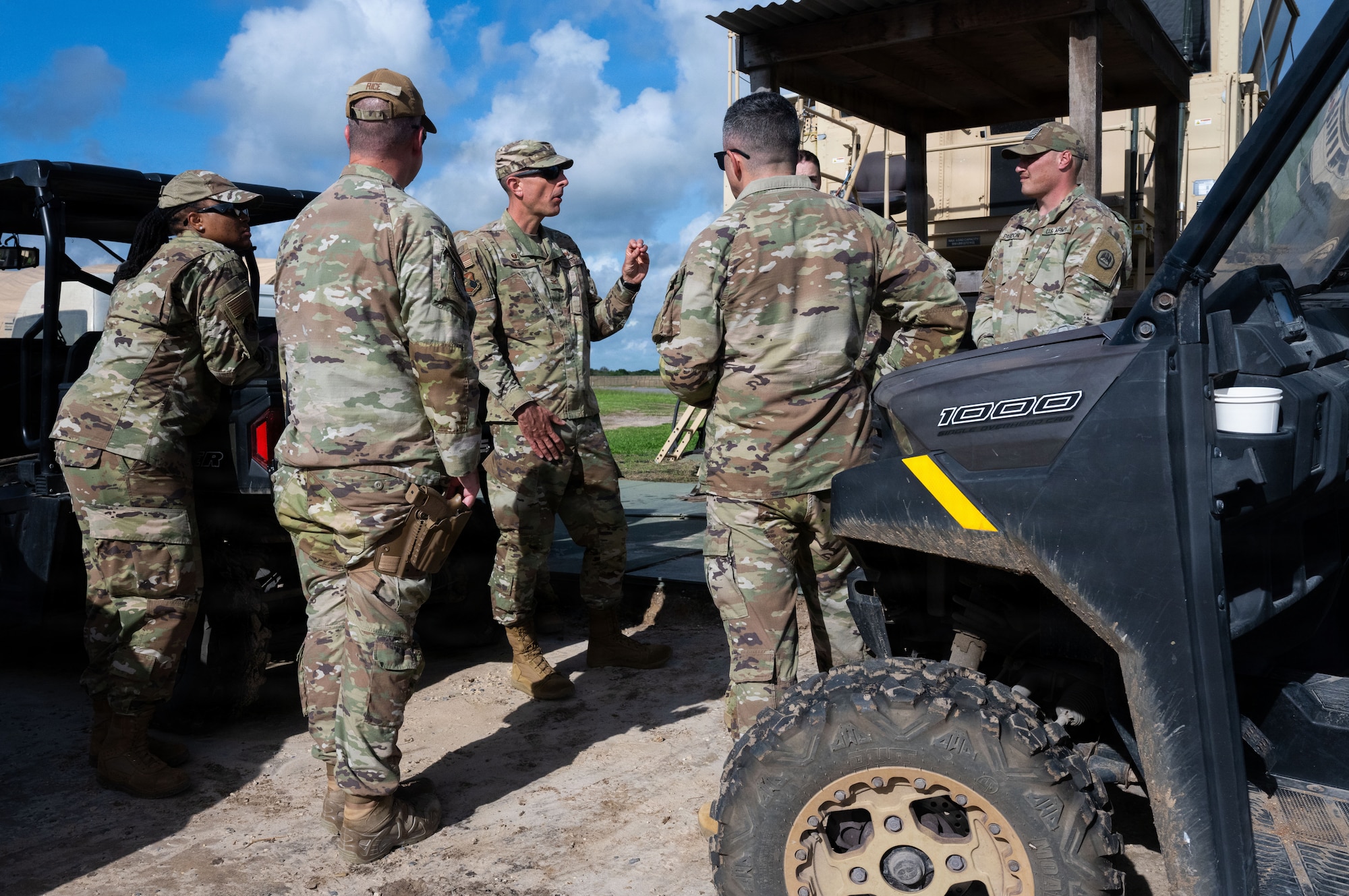 U.S. Air Force Col. Gabriel Brown, 406th Air Expeditionary Wing commander, center, speaks to Airmen assigned to the 475th Expeditionary Air Base Squadron during a site visit at Manda Bay, Kenya, May 6, 2026. Brown and U.S. Air Force Chief Master Sgt. Jason Logan, 406th AEW command chief, met with Airmen and leaders to discuss operational priorities and mission support capabilities. (U.S. Air Force photo by Maj. Porter Maerz)