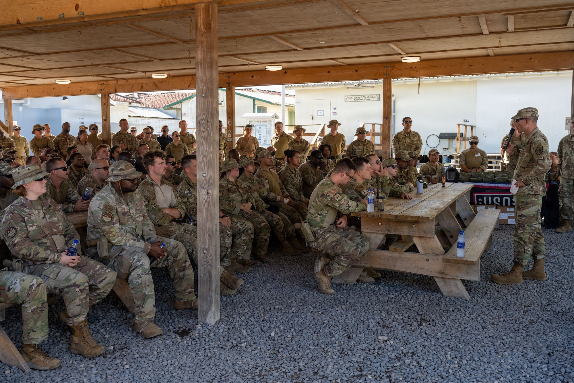 U.S. Air Force Col. Gabriel Brown, 406th Air Expeditionary Wing commander, speaks with Airmen assigned to the 475th Expeditionary Air Base Squadron during an all-call at Manda Bay, Kenya, May 6, 2026. Brown spoke with Airmen about mission readiness, professional development and quality of life in deployed environments while reinforcing the importance of integrity, selflessness, determination and respect across the Wing. (U.S. Air Force photo by Maj. Porter Maerz)