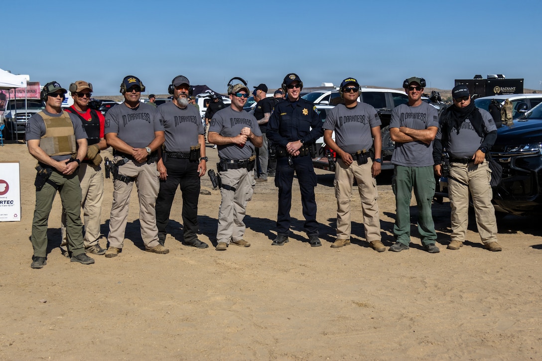 Personnel from Marine Corps Logistics Base  Barstow Provost Marshal’s Office, Barstow Police Department, California Highway Patrol, and San Bernardino County Sheriff's Department participate in a shooting competition at the Barstow Police shooting range in Barstow, California, May 15.The event represented the inaugural competition following the COVID-19 pandemic, with the team from the MCLB Barstow Provost Marshal’s Office securing first place.