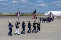 The Joint Service Color Guard march to their positions during a military departure ceremony.