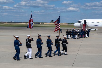 The Joint Service Color Guard march to their positions during a military departure ceremony.
