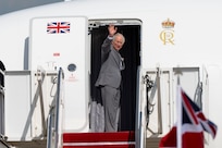 King Charles III waves as his departs from his state visit.