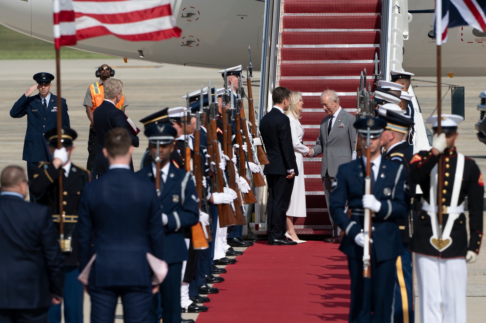 King Charles III shakes hands with Monica Crowley, Chief of Protocol.